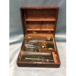 A Victorian mahogany cased chemical set with glass vessels by J Ronchetti of Manchester in fitted