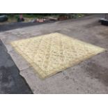 An oriental style Wilton wool carpet, the cream field with allover flower spray pattern, within