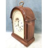 An Edwardian mahogany mantle clock in domed Georgian style case with fluted canted corners, having