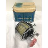 A boxed Penn 4/0 Senator big game sea fishing multiplier reel and line, with 3.75in drum, rod clamp,