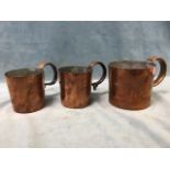 A graduated set of three Victorian naval measures in the form of tankards with riveted tubular