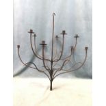 A wrought iron hanging candelabra with ten candleholders around central hooked shaft. (32in)