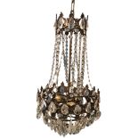 A bag chandelier, the foliate gilt metal rose suspending a scrolled brass frame hung with cut