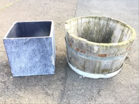 A circular oak barrel planter, the staves bound by strap bands; and a square lead style plant pot