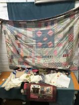 Miscellaneous textiles including a 20th century patchwork quilt, two knitted patchwork blankets, two