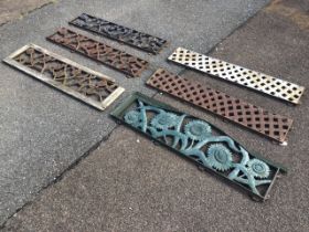 A set of three rectangular cast iron pierced panels from bench backs, decorated with entwined