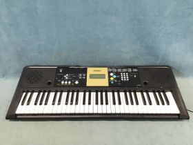 A Yamaha YPT-200 portable multifunction electronic keyboard, with adapter, integral speakers and