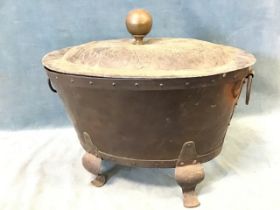 An oval art nouveau copper coal bin, the domed lid embossed with acorns and oak leaves with knob