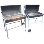 A barrel barbecue with hinged lid revealing grill platform on tubular metal stand with two wheels