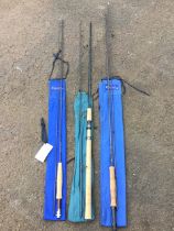 An unused Greys two-piece Montana 9ft fly rod with sleeve; a unused Greys two-piece 9ft spinning rod