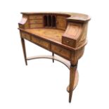 A 19th century Italian walnut and marquetry demi-lune Carlton House desk, the curved