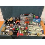 A quantity of fishing tackle including weights, spinners, floats, hooks, lines, boxes, backing,