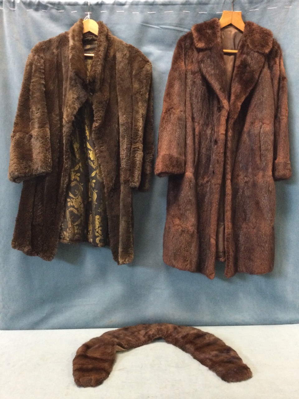 A ladies musquash fur coat; a beaver coat with yellow and black brocade lining; and a mink fur