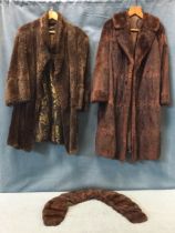 A ladies musquash fur coat; a beaver coat with yellow and black brocade lining; and a mink fur