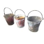 Three British Rail galvanised fire buckets, with swing handles and traces of original painted