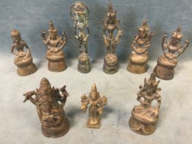 A collection of nine antique Indian bronze figures of Hindu deities - tallest 5in. (9)