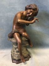 A 20th century bronze, seated fisher boy listening to the sea in a shell, with brown, black and