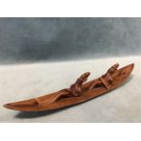 An West African carved hardwood canoe with two rowers. (12in)