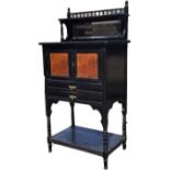 A Victorian aesthetic ebonised side cabinet, the back with gallery spindles above a shelf and