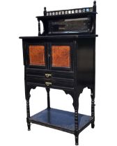 A Victorian aesthetic ebonised side cabinet, the back with gallery spindles above a shelf and