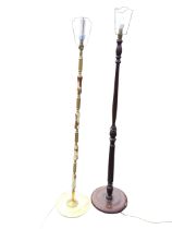 A turned and reeded mahogany standard lamp, on a circular turned base - 56in; and a brass and onyx