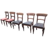 A set of three Victorian mahogany tablet back dining chairs with flame veneered rails above