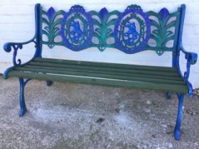 A cast iron garden bench, the back cast with oval wreaths containing riders on rearing horses,