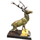 A C20th bronze stag, the beast standing on polished slate & marble stepped plinth. (15.5in x 5in x