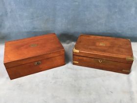 A Victorian rosewood writing slope with brass mounts, opening to a pen tray and ink bottles, the