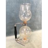 A 1930s Pyrex Cona coffee maker, with chrome and wood stand and spirit burner. (16.5in)