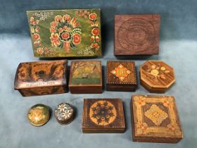 A collection of folk art carved, painted and pyrographed wood trinket boxes - Norwegian, Indian,