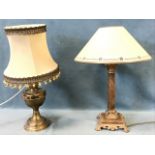 An art nouveau style column tablelamp with pierced scrolled decoration fitted with conical shade;