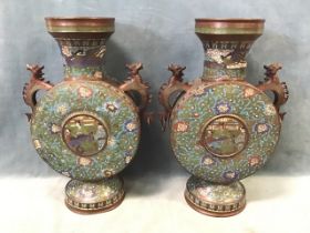 A pair of Chinese cloisonné moon flasks, with flared necks above flat circular bodies decorated with