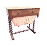 A Victorian walnut sewing table, the rectangular top above a fitted drawer with turned knobs and a