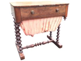 A Victorian walnut sewing table, the rectangular top above a fitted drawer with turned knobs and a