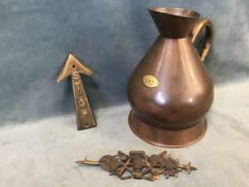 A Georgian copper gallon measure, mounted with brass royal arms plaque - 12.5 in; a brass stop