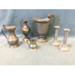 A collection of French pewter - a Louis XIV style wide mouth ewer, two covered jugs, a cream jug and