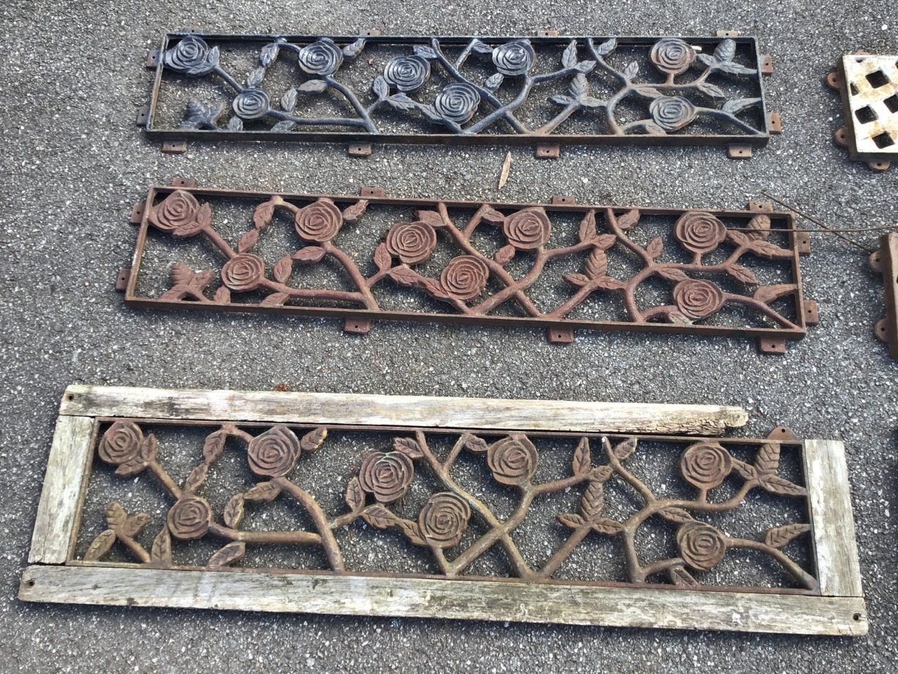 A set of three rectangular cast iron pierced panels from bench backs, decorated with entwined - Image 2 of 3