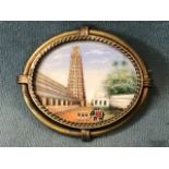 A gilt metal brooch set with an Indian miniature of the Gopuram tower at Srivilliputtur Tamilnadu.