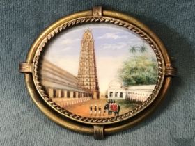 A gilt metal brooch set with an Indian miniature of the Gopuram tower at Srivilliputtur Tamilnadu.