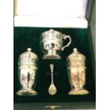 A cased hallmarked sterling silver cruet set, the Irish pieces decorated with celtic style bands -