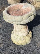 A small composition stone pebble form birdbath - 16in.