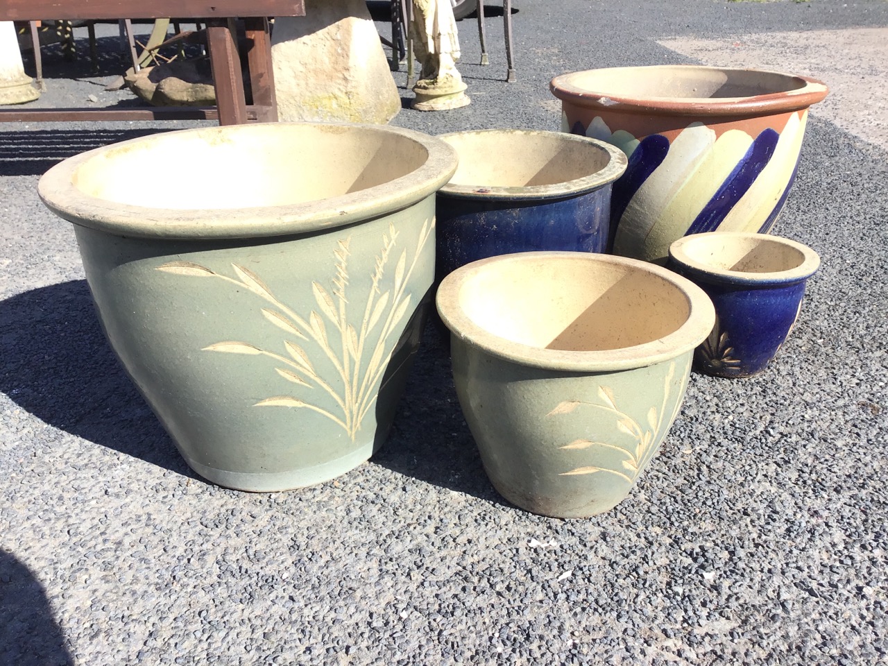 A graduated pair of green glazed terracotta planters with flat rims and incised grass designs; a - Image 2 of 3