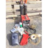 A Cebora Pocket Turbo 130 arc welder, with two CO2 cylinders, mask, gloves, accessories, etc. (A