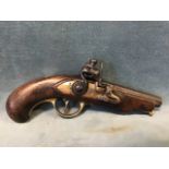 A late 18th century flintlock pocket pistol with fluted steel barrel, brass lock plate and trigger