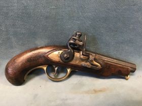 A late 18th century flintlock pocket pistol with fluted steel barrel, brass lock plate and trigger