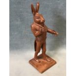 A 19th century carved walnut figure of a hare dressed as a dandy, probably French. (6in)