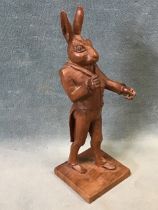 A 19th century carved walnut figure of a hare dressed as a dandy, probably French. (6in)