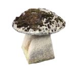 A composition stone garden staddle stone, the mushroom shaped top on a square tapering column. (22in