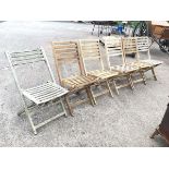 A set of five folding hardwood slatted garden chairs on sabre legs, with sustainable forrest labels;